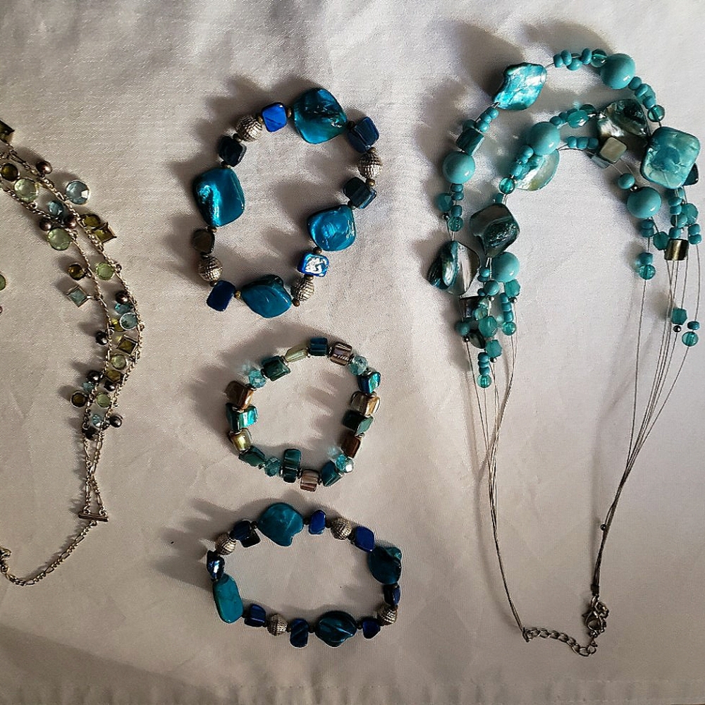 2 blue necklaces with 3 blue bracelets